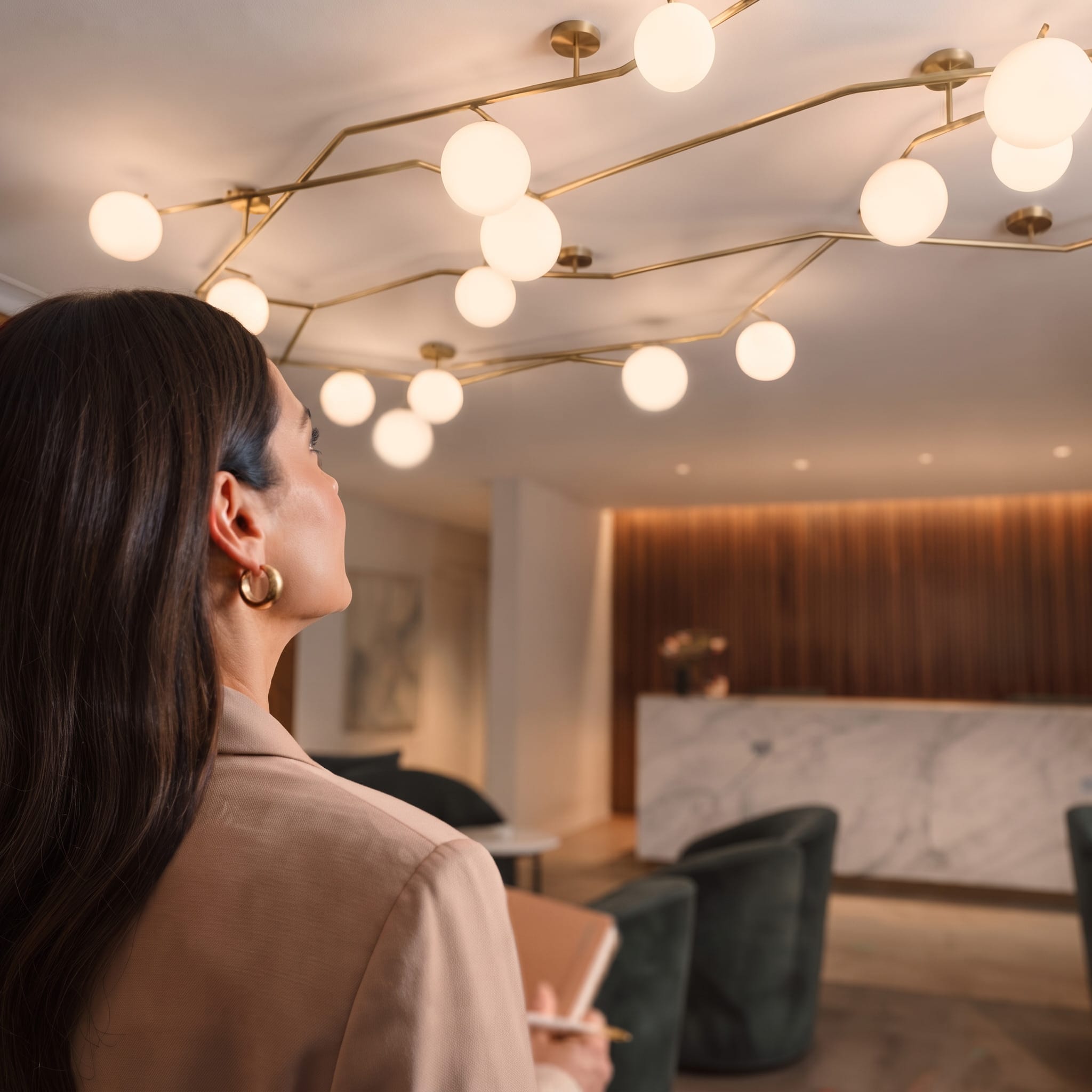 Representative walking through a hotel guest room
